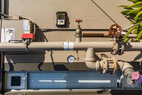 Close up of main shut off valve with pressure gauge device